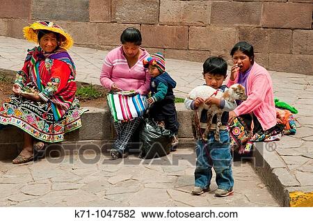 Peruvian ladies in traditional dress with their children in Cusco, Peru, South America View Large Photo Image Stock Image - Peruvian ladies in traditional dress with their children in Cusco, Peru, South America. Fotosearch