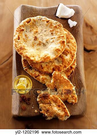 Peshwari Naan coconut sultanas and honey Bread - Indian Cuisine View Large Photo Image Stock Photograph - Peshwari Naan coconut sultanas and honey Bread - Indian Cuisine. Fotosearch