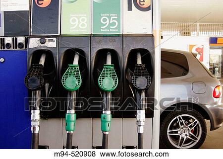 Petrol pumps and car in the back. View Large Photo Image Stock Photo - Petrol pumps and car in the back.. Fotosearch
