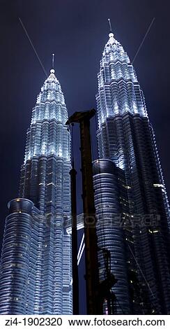 Petronas towers Kuala Lumpur at night with construction crane on the foreground View Large Photo Image Stock Image - Petronas towers Kuala Lumpur at night with construction crane on the foreground. Fotosearch