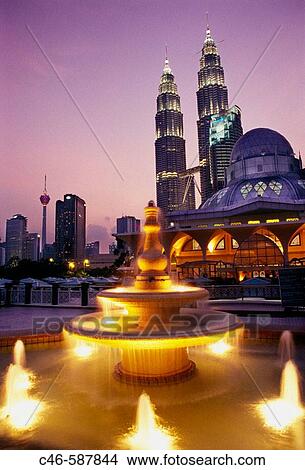 Petronas twin towers (the tallest building in the world), Asy-Syakirin Mosque in the KLCC Park in foreground. Kuala Lumpur. Malaysia View Large Photo Image Picture - Petronas twin towers (the tallest building in the world), Asy-Syakirin Mosque in the KLCC Park in foreground. Kuala Lumpur. Malaysia. Fotosearch