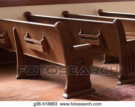 Stock Image - Pews (or benches/seats) in a historic Jewish Synagaogue in Tucson, Arizona. Fotosearch