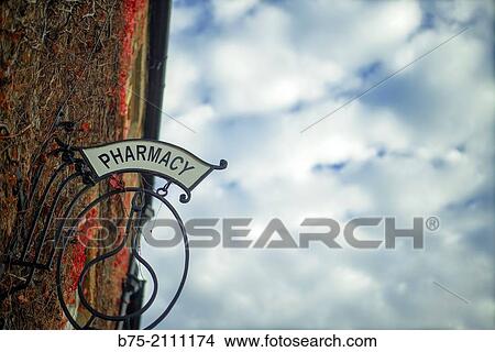 Picture - Pharmacy ad on a facade in a village. Yorkshire Dales, England, UK, Europe.. Fotosearch