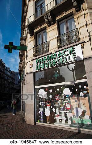 Stock Photo - Pharmacy in Dansaert district central Brussels Belgium Europe.. Fotosearch