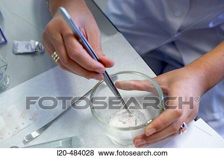 Stock Photo - Pharmacy, preparing drug in mortar. Hospital Universitario Gran Canaria Doctor Negrin, Las Palmas de Gran Canaria. Canary Islands, Spain. Fotosearch