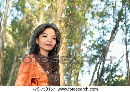 Philippine woman outside enjoying nature View Large Photo Image Stock Photo - Philippine woman outside enjoying nature. Fotosearch