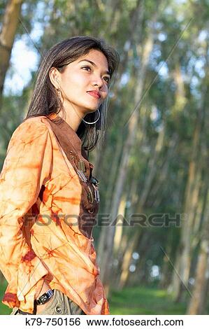Philippine woman outside enjoying nature View Large Photo Image Stock Photograph - Philippine woman outside enjoying nature. Fotosearch