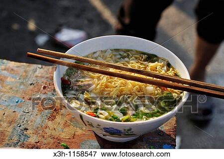 Pho, national dish, is a Vietnamese beef and noodle soup, market of Yen Minh, Ha Giang province, Northern Vietnam, southeast asia View Large Photo Image Stock Photo - Pho, national dish, is a Vietnamese beef and noodle soup, market of Yen Minh, Ha Giang province, Northern Vietnam, southeast asia. Fotosearch
