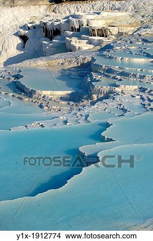 Photo of Pamukkale Travetine Terrace, Turkey Images of the white Calcium carbonate rock formations View Large Photo Image Picture - Photo of Pamukkale Travetine Terrace, Turkey Images of the white Calcium carbonate rock formations. Fotosearch