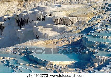 Photo of Pamukkale Travetine Terrace, Turkey Images of the white Calcium carbonate rock formations View Large Photo Image Stock Image - Photo of Pamukkale Travetine Terrace, Turkey Images of the white Calcium carbonate rock formations. Fotosearch
