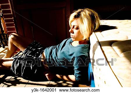 Photograph of a girl lying in the floor with the sun in her face. View Large Photo Image Stock Image - Photograph of a girl lying in the floor with the sun in her face.. Fotosearch