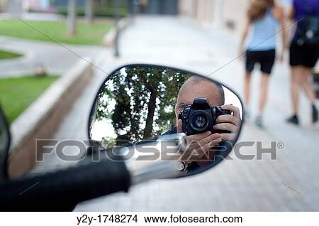 Photographer and motorbike mirror in Valencia City, Spain View Large Photo Image Picture - Photographer and motorbike mirror in Valencia City, Spain. Fotosearch