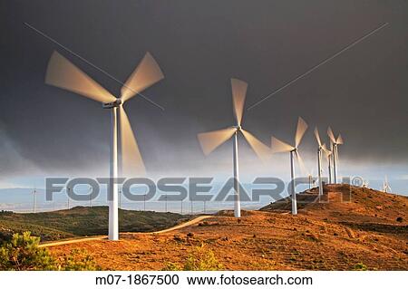 Photographer taking beautiful sunset pictures by Eolic park, wind power, wind energi, Codes mountains, Navarra, Spain, Europe View Large Photo Image Stock Image - Photographer taking beautiful sunset pictures by Eolic park, wind power, wind energi, Codes mountains, Navarra, Spain, Europe. Fotosearch