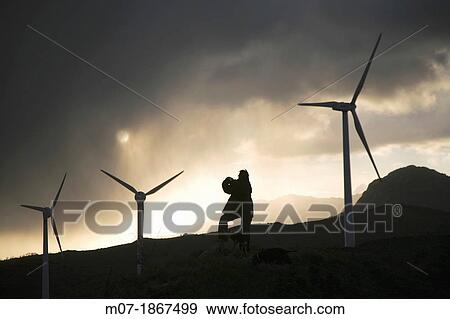Photographer taking beautiful sunset pictures by Eolic park, wind power, wind energi, Codes mountains, Navarra, Spain, Europe View Large Photo Image Stock Photo - Photographer taking beautiful sunset pictures by Eolic park, wind power, wind energi, Codes mountains, Navarra, Spain, Europe. Fotosearch