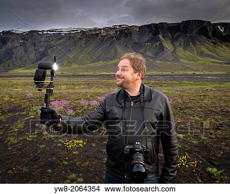 Photographer taking self portrait, South Coast, Iceland. View Large Photo Image Picture - Photographer taking self portrait, South Coast, Iceland.. Fotosearch