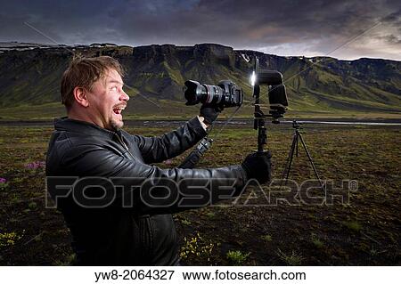 Photographer taking self portrait, South Coast, Iceland. View Large Photo Image Stock Photo - Photographer taking self portrait, South Coast, Iceland.. Fotosearch