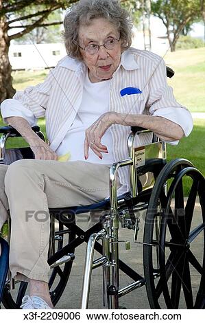 Photographers feisty mom in wheelchair enjoying the outdoors at the nursing home age 96. Battle Lake Minnesota MN USA. View Large Photo Image Stock Photograph - Photographers feisty mom in wheelchair enjoying the outdoors at the nursing home age 96. Battle Lake Minnesota MN USA.. Fotosearch