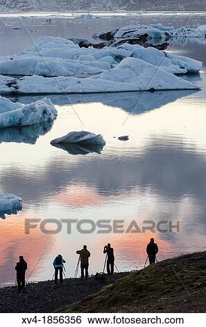 Photographers silhouette in Jokulsarl? n glacial lagoon Iceland View Large Photo Image Stock Photograph - Photographers silhouette in Jokulsarl? n glacial lagoon Iceland. Fotosearch