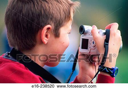 photographing boy View Large Photo Image Stock Image - photographing boy. Fotosearch