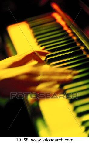 Pianist playing in night club View Large Photo Image Stock Photo - Pianist playing in night club. Fotosearch