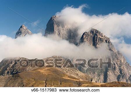 Stock Image - Pic du Midi d? Ossau (France) in the clouds, view from the Tena Valley in the Spanish province of Huesca. Fotosearch