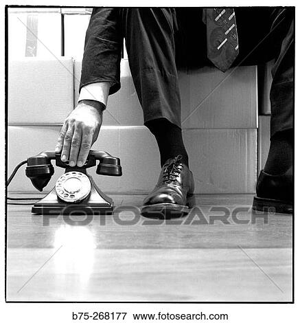 Stock Photo - Picking up the phone. Fotosearch