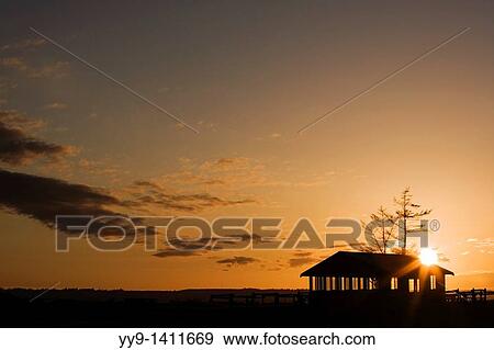 Stock Photo - Picnic shelter at sunset - Camano Island State Park - Camano Island, Washington. Fotosearch