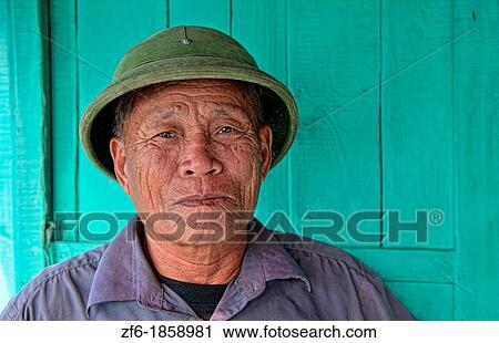 Picturesque scene old man in helmet fishing village Halong Bay Ha Long relax Vietnam View Large Photo Image Stock Image - Picturesque scene old man in helmet fishing village Halong Bay Ha Long relax Vietnam. Fotosearch