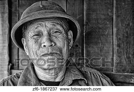 Picturesque scene old man in helmet fishing village Halong Bay Ha Long relax Vietnam View Large Photo Image Stock Photo - Picturesque scene old man in helmet fishing village Halong Bay Ha Long relax Vietnam. Fotosearch