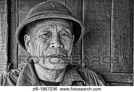 Picturesque scene old man in helmet fishing village Halong Bay Ha Long relax Vietnam View Large Photo Image Stock Photograph - Picturesque scene old man in helmet fishing village Halong Bay Ha Long relax Vietnam. Fotosearch