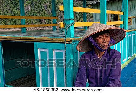 Picturesque scene old woman in purple in fishing village Halong Bay Ha Long relax Vietnam View Large Photo Image Stock Image - Picturesque scene old woman in purple in fishing village Halong Bay Ha Long relax Vietnam. Fotosearch