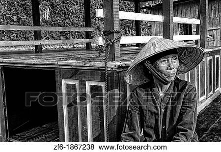 Picturesque scene old woman in purple in fishing village Halong Bay Ha Long relax Vietnam View Large Photo Image Stock Photo - Picturesque scene old woman in purple in fishing village Halong Bay Ha Long relax Vietnam. Fotosearch