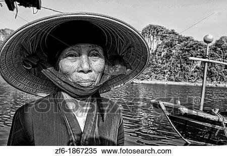 Picturesque scene old woman in purple in fishing village in Halong Bay Ha Long relax Vietnam View Large Photo Image Stock Photography - Picturesque scene old woman in purple in fishing village in Halong Bay Ha Long relax Vietnam. Fotosearch