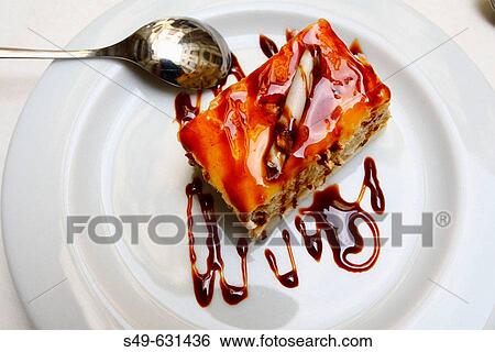 Piece of cake on white dish View Large Photo Image Stock Photograph - Piece of cake on white dish. Fotosearch