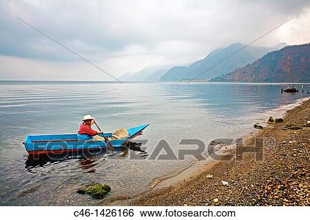 Stock Photograph - Piers in AtitlBn Lake Panajachel SololB Department Guatemala Central America. Fotosearch