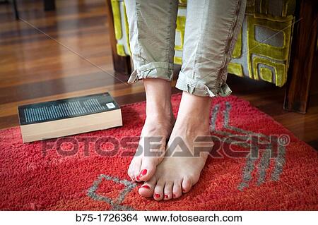 pies de mujer descalzos relajada con libro en el suelo, bare feet relaxed woman with book on the floor View Large Photo Image Picture - pies de mujer descalzos relajada con libro en el suelo, bare feet relaxed woman with book on the floor. Fotosearch