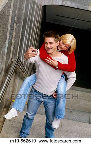 piggy back couple's portrait View Large Photo Image Stock Photo - piggy back couple's portrait. Fotosearch