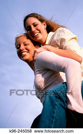 Piggy-back Sisters, Friends, View Large Photo Image Stock Photo - Piggy-back Sisters, Friends,. Fotosearch