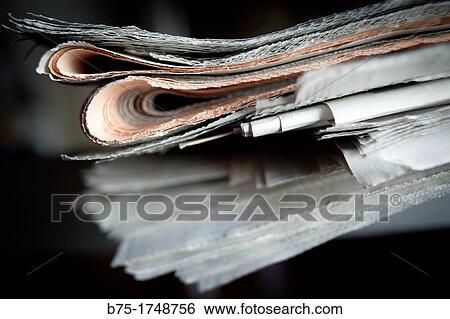 Pile of folded newspapers, press View Large Photo Image Stock Photograph - Pile of folded newspapers, press. Fotosearch