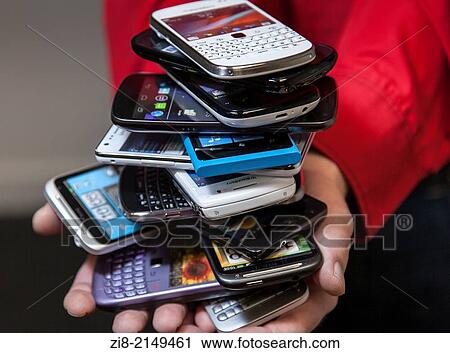 Stock Image - Pile of smart phones.. Fotosearch