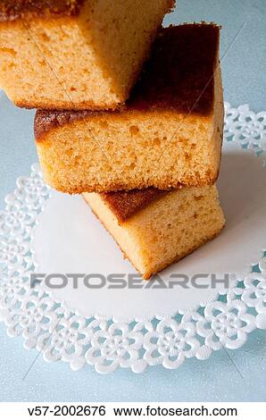 Piled up sponge cakes. Close view. View Large Photo Image Stock Photograph - Piled up sponge cakes. Close view.. Fotosearch