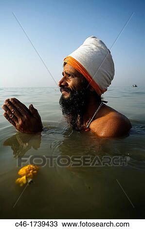 Pilgrim bathing at the confluence of the river Ganges and the Bay of Bengal, Sagar Mela, India, Ganges River. View Large Photo Image Stock Image - Pilgrim bathing at the confluence of the river Ganges and the Bay of Bengal, Sagar Mela, India, Ganges River.. Fotosearch