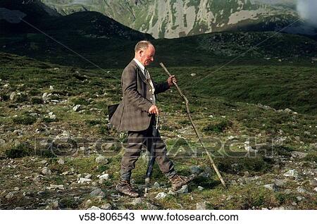 Stock Image - PILGRIM ON THE WAY TO CROAGH PATRICK, IRELAND? S HOLY MOUNTAIN, COUNTY MAYO, IRELAND. Fotosearch