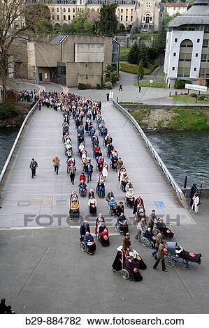 Stock Image - Pilgrimage, Lourdes. Hautes-Pyrenees, Midi-Pyrenees, France. Fotosearch