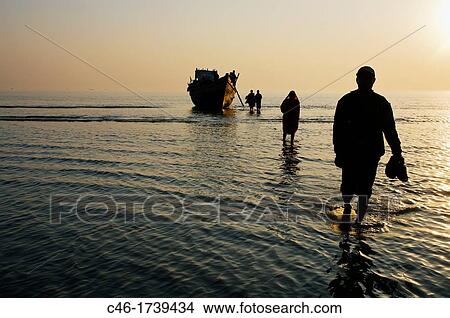 Pilgrims arriving by boat to the Sagar Mela, India, Ganges River. View Large Photo Image Picture - Pilgrims arriving by boat to the Sagar Mela, India, Ganges River.. Fotosearch