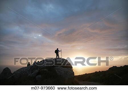 Pilgrims arriving to Finisterre cape at sunset, Galicia, Spain, Europe. View Large Photo Image Stock Image - Pilgrims arriving to Finisterre cape at sunset, Galicia, Spain, Europe.. Fotosearch