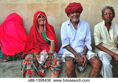 Pilgrims at the ghat by the Ganges river View Large Photo Image Stock Image - Pilgrims at the ghat by the Ganges river. Fotosearch