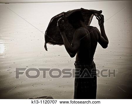 Pilgrims bathing at ghat steps on river Ganges Varanasi banaras Uttar Pradesh India View Large Photo Image Stock Photo - Pilgrims bathing at ghat steps on river Ganges Varanasi banaras Uttar Pradesh India. Fotosearch