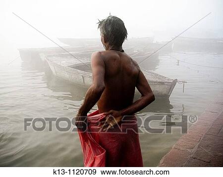 Pilgrims bathing at ghat steps on river Ganges Varanasi banaras Uttar Pradesh India View Large Photo Image Stock Photo - Pilgrims bathing at ghat steps on river Ganges Varanasi banaras Uttar Pradesh India. Fotosearch