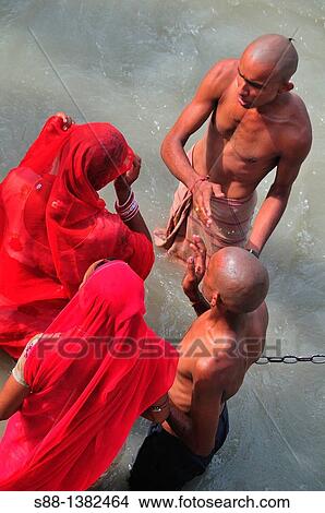 Picture - Pilgrims bathing at Har Ki Pairi ghat by the Ganges river. Fotosearch